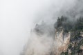 Morning fog in the mountains at sunrise. Clouds over the rocks and trees Royalty Free Stock Photo