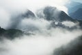 Morning fog in the mountains at sunrise. Clouds over the rocks and trees Royalty Free Stock Photo