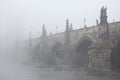 Morning fog over the Charles Bridge in Prague. Royalty Free Stock Photo