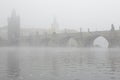 Morning fog over the Charles Bridge in Prague. Royalty Free Stock Photo