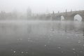 Morning fog over the Charles Bridge in Prague. Royalty Free Stock Photo