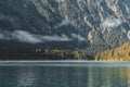 Morning fog over Plansee lake in Austria village in summer