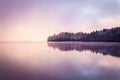 Morning fog and reflections on the lake Royalty Free Stock Photo