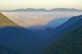 Morning fog at sunrise in autumn mountains of West Virginia in Babcock State Park Royalty Free Stock Photo