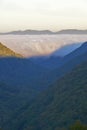 Morning fog at sunrise in autumn mountains of West Virginia in Babcock State Park