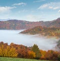 Morning foggy clouds in autumn mountain countryside. Ukraine, Carpathian Mountains, Transcarpathia Royalty Free Stock Photo