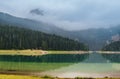 Morning Foggy Sunrise over Mountain Lake and Forest Royalty Free Stock Photo