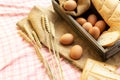 Morning food. breakfast and baked bread concept. Fresh fragrant bread and egg on the fabric sack. On wooden table