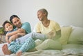 Morning, gay family and hug on bed in home bedroom for security, quality time and love. Adoption, lesbian or LGBTQ women Royalty Free Stock Photo