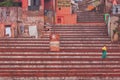 Morning on ghat steps at Benares