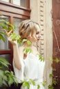 Morning girl resting sitting on a Turkish sofa. A woman in light clothes is preparing for the arrival of her beloved man Royalty Free Stock Photo