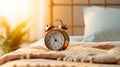 Morning happiness woman stretching in bed with sunlight and alarm clock, embracing a new day Royalty Free Stock Photo