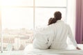 Morning of happy young couple resting in hotel room Royalty Free Stock Photo