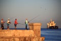 Morning in Havana. Fishermen on the pier
