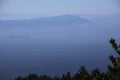 Morning haze on the Three Sisters and other Cascade volcanic peaks Royalty Free Stock Photo