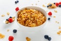 Morning healthy Breakfast honey Cornflakes with fresh fruits of Raspberry, blueberries Royalty Free Stock Photo