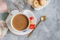 Morning hot chocolate in the original white Cup with a blue button on the background of biscuits. Invigorating Breakfast. Copy