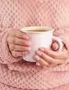 Morning hot coffee on cold autumn morning, hands holding a mug with a drink, cozy atmosphere, vertical Royalty Free Stock Photo