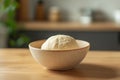 During morning hours, the bread-making process unfolds with dough rising in a round metal bowl, placed in a kitchen Royalty Free Stock Photo