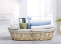 Morning hygiene.Toothbrushes,towels and soap in basket,wash items