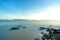 The morning indigo ocean and smooth wave surface. There are many rocks in the sea Royalty Free Stock Photo