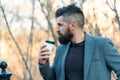 Morning inspiration. Thoughtful man drink take away coffee. Coffee aesthetics. Mature hipster with beard with coffee cup