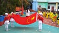 Shenzhen, China: in the morning, the kindergarten held a flag-raising ceremony, children gathered in the playground