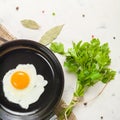 Morning in the kitchen. Cooking breakfast. Fried egg. Light background Royalty Free Stock Photo