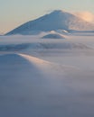 Morning landscape of snow-capped mountains. Foggy landscape of the coldest place on Earth - Oymyakon