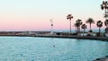 Morning landscape of sunrise on sea with embankment with palm trees. Panoramic skyline view of beach coastline, idealism