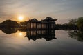 Morning landscapes with trees, cherry blossoms and pond in Quyuan Garden, a public park of West Lake in Hangzhou, China Royalty Free Stock Photo