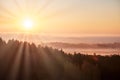 Morning landspace with sun rays. Beautiful landscape with forest and fog.Lithuanian landscape Royalty Free Stock Photo