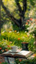 Morning leisure in garden coffee, book, flowers on lush lawn