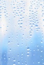 Morning light blue dew droplet on window Royalty Free Stock Photo