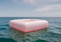 Large faded inflatable ring floating on ocean surface.AI Generated Royalty Free Stock Photo