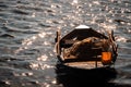 Morning light with almost sunlight, orange radius spread across sea, with fishing boat and sparkling sea surface. Small fishing Royalty Free Stock Photo