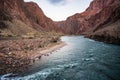 Morning Light Turns the Colorado River Blue in the Bottom of the Grand Canyon Royalty Free Stock Photo