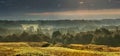 Morning, meadow and away forest in the fog. Autumn landscape. Beautiful view of the vastness in the fog Royalty Free Stock Photo