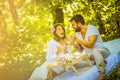 Morning meal in nature. Young couple. Royalty Free Stock Photo