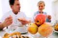 Morning meal. Senior man and woman having breakfast. Royalty Free Stock Photo