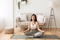 Morning Meditation. Asian Girl Practicing Yoga at Home Royalty Free Stock Photo