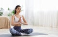 Morning Meditation. Sporty Korean Girl Practicing Yoga Exercises At Home Royalty Free Stock Photo
