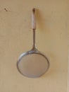 Morning metal strainer on kitchen wall Royalty Free Stock Photo