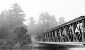 Morning mist at Bridge over Corry lake.