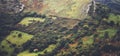 Morning mist house in the mountain peaks on natural landscape. Green valley on background foggy dramatic sky, mountain tops Royalty Free Stock Photo