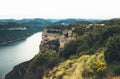 Morning mist in the mountain peaks on natural landscape. Green valley on background foggy dramatic sky, mountain tops and river. P Royalty Free Stock Photo