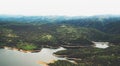 Morning mist in the mountain peaks on natural landscape. Green valley on background foggy dramatic sky, mountain tops and river Royalty Free Stock Photo