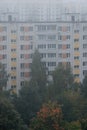 Morning mist over panel houses in early autumn Royalty Free Stock Photo