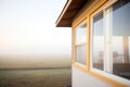 morning mist on prairie, ribbon windows of minimalist cabin