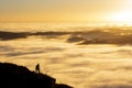 Landscape Photographer taking pictures of sunrise and morning fog atTe Mata Peak, Hawke`s Bay, New Zealand Royalty Free Stock Photo